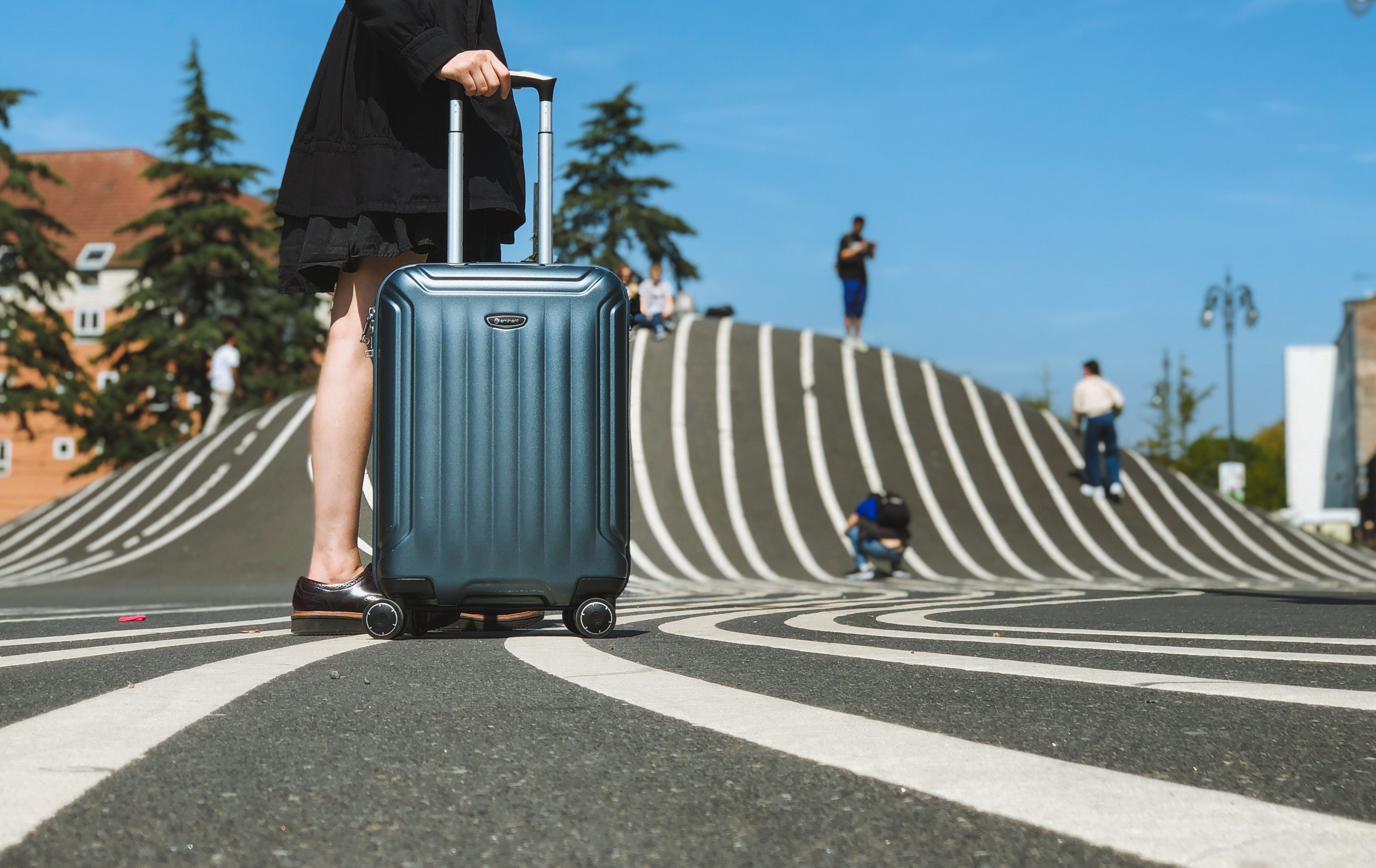 woman with Eminent suitcase